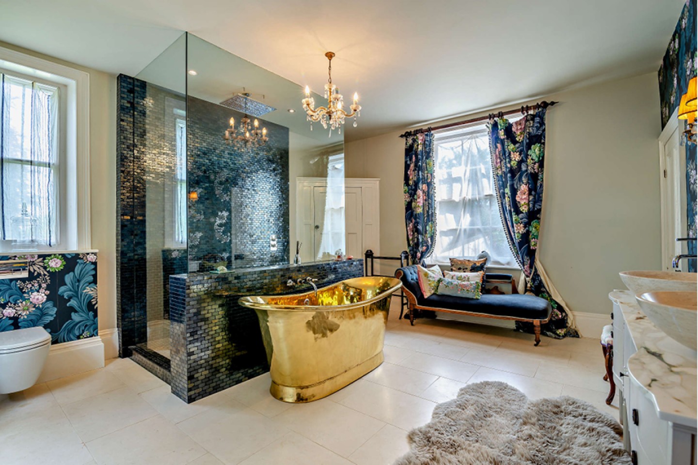 Grand bathroom with walk-in showers, gold free-standing bath and shezlong 